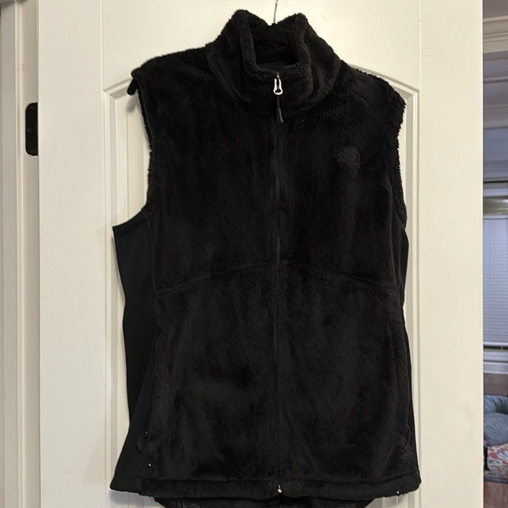 Black North Face fleece vest.